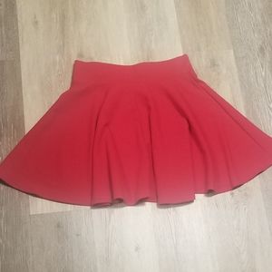 Red skirt with soft pleats and wide waistband